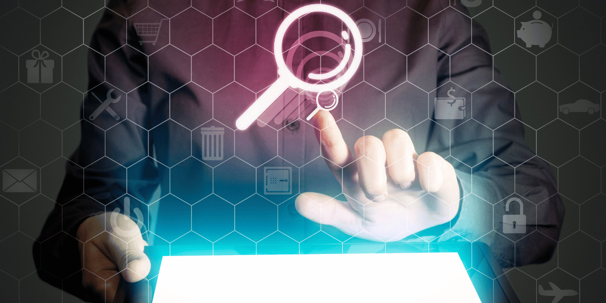 Person with tablet. Graphic of a magnifying glass.