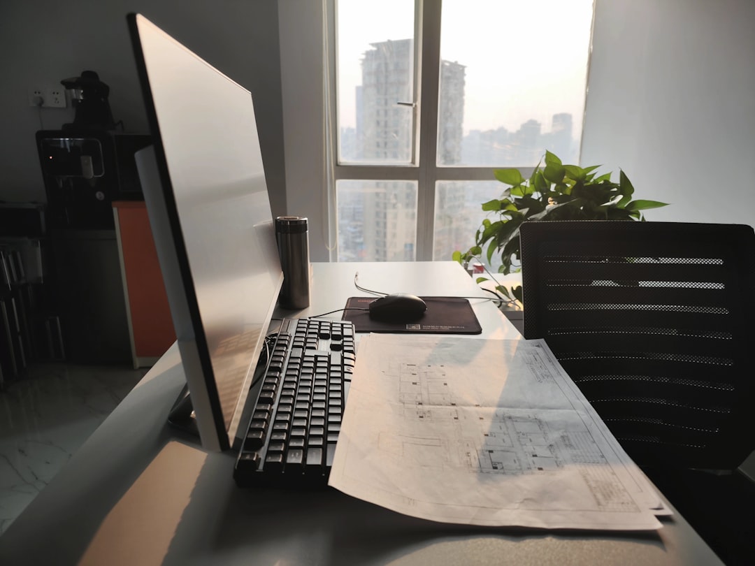 Clean, modern desk with architectural blueprints laid out, symbolizing clear structure and planning for content.