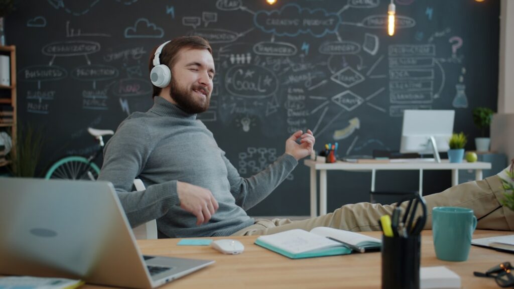 Professional thoughtfully reviewing architectural blueprints on a clean, modern desk, symbolizing strategic pre-sale home ...
