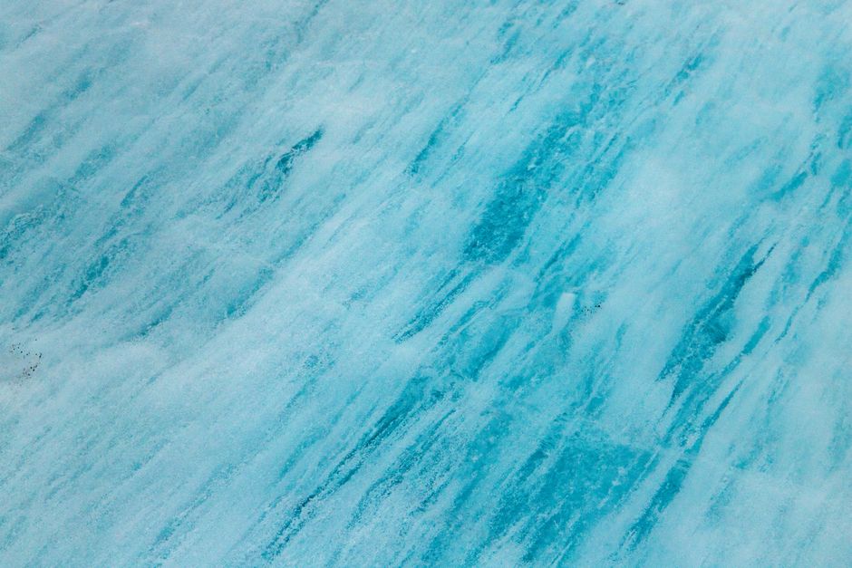 A large iceberg with its massive, complex structure visible beneath the water's surface, representing the deep technical SEO tactics that go beyond surface-level metadata.