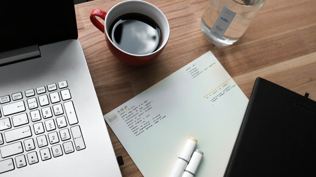 An overhead view of real estate closing documents and a pen neatly arranged on a clean, minimal desk, representing a seamless and organized home closing process.